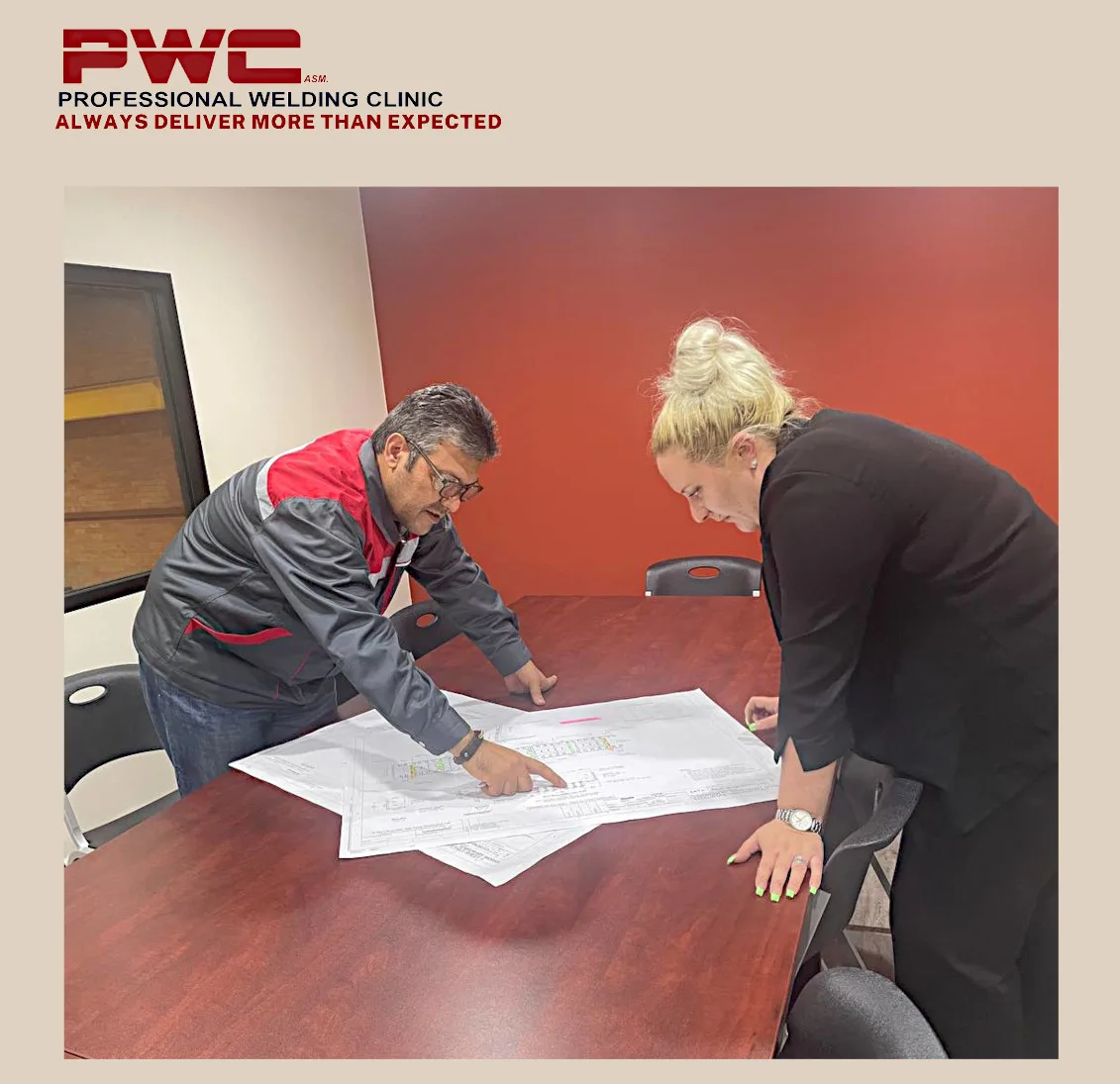 Reviewing drawings and weld maps with a client.